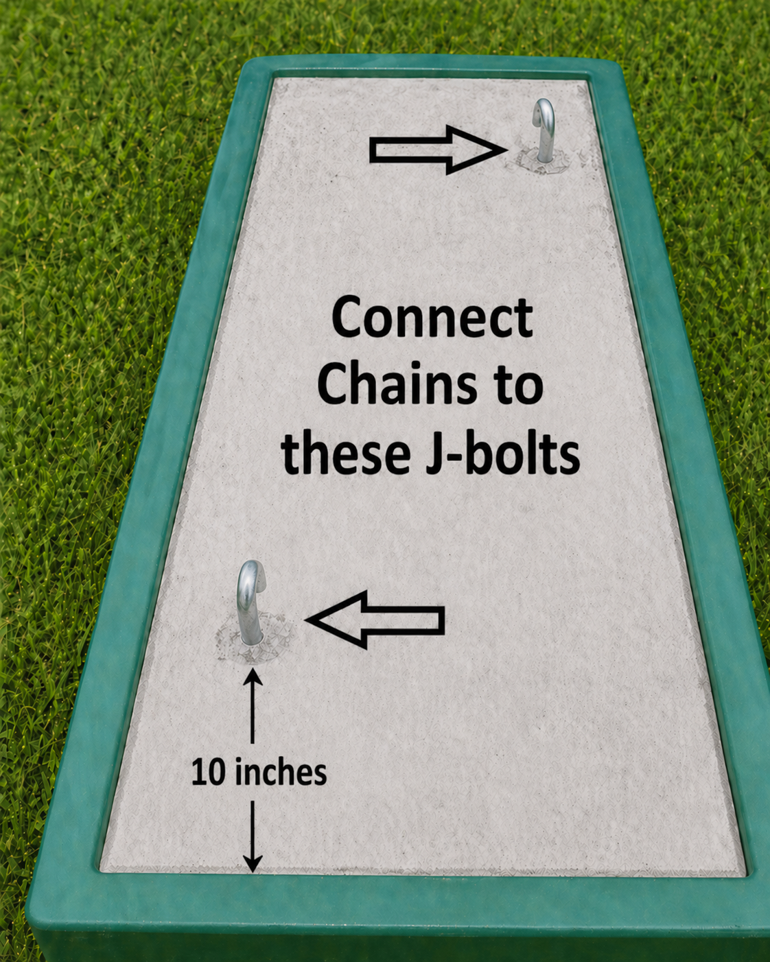 Cattle guard form with J-bolt hardware placed before cure